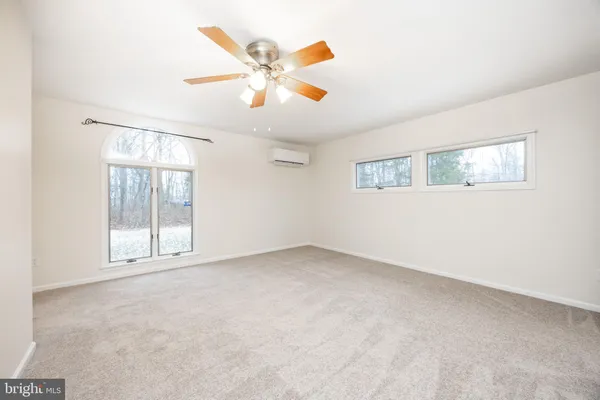 a bathroom with a sink a toilet a mirror and vanity