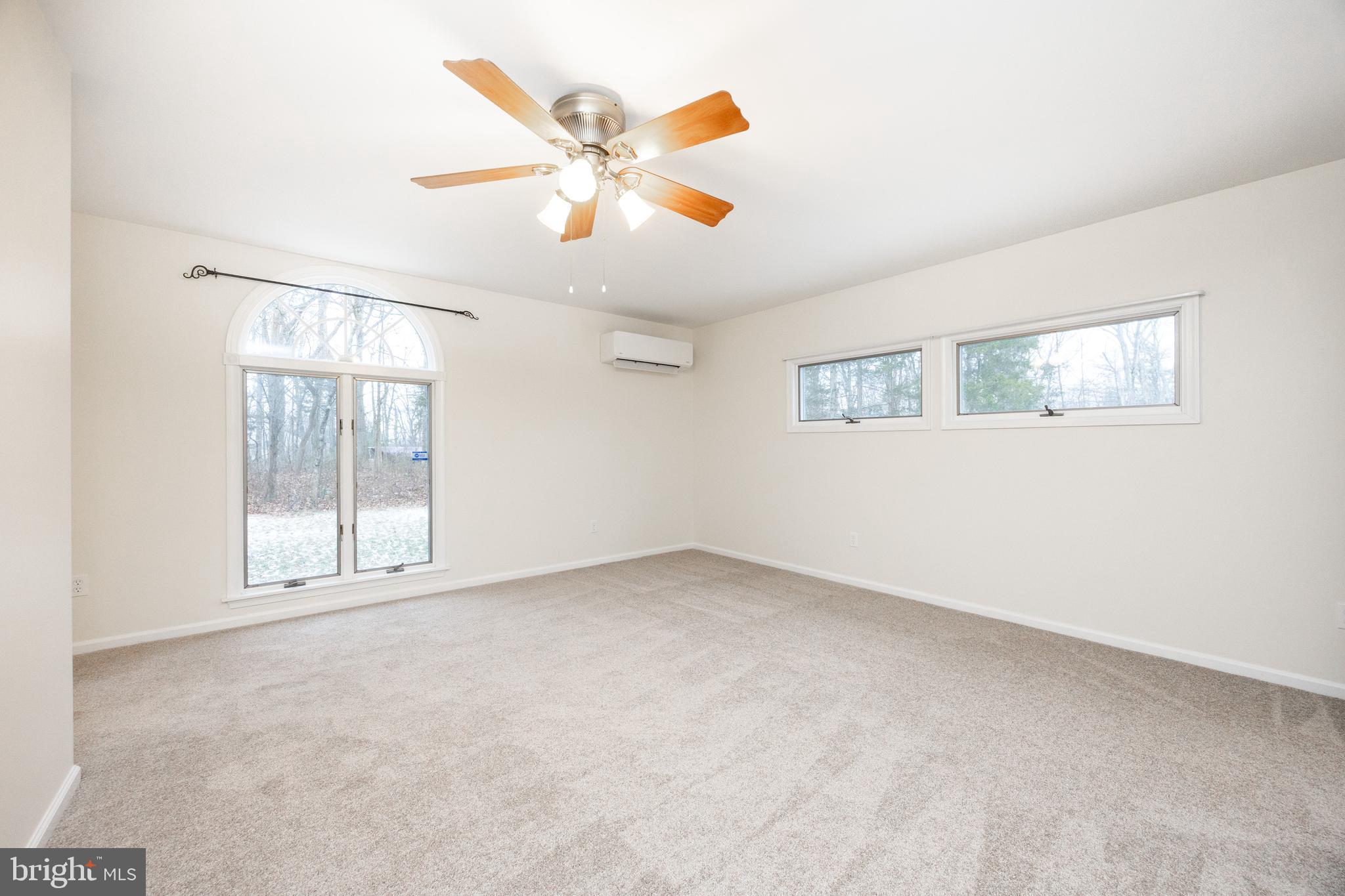 5816 Upper Ridge Road Pennsburg, PA 18073 - Photo 16 of 71 an empty room with windows and fan