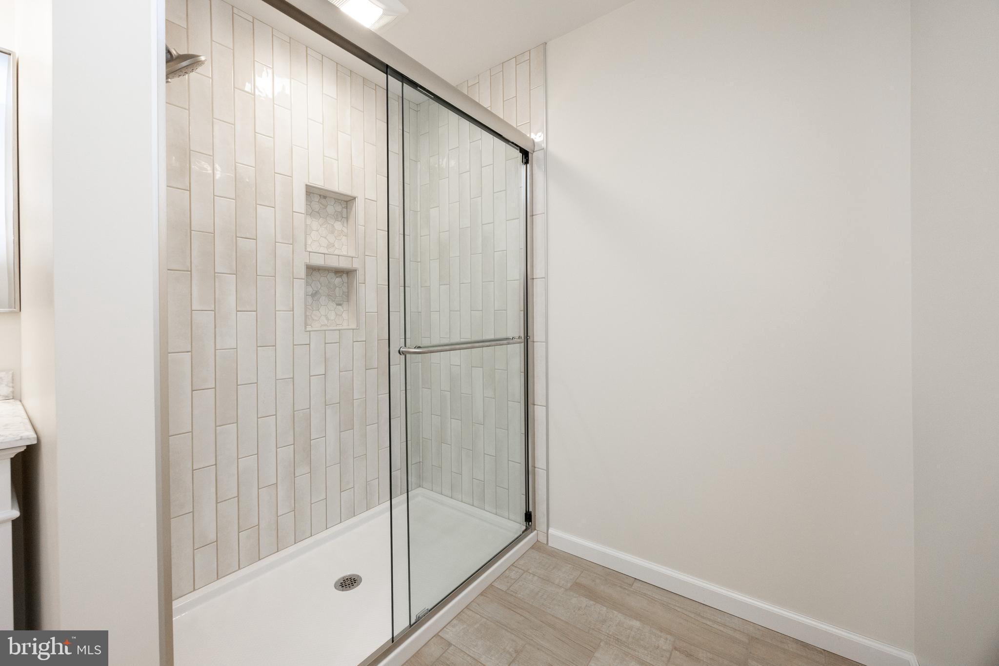 5816 Upper Ridge Road Pennsburg, PA 18073 - Photo 19 of 71 a bathroom with a glass shower door