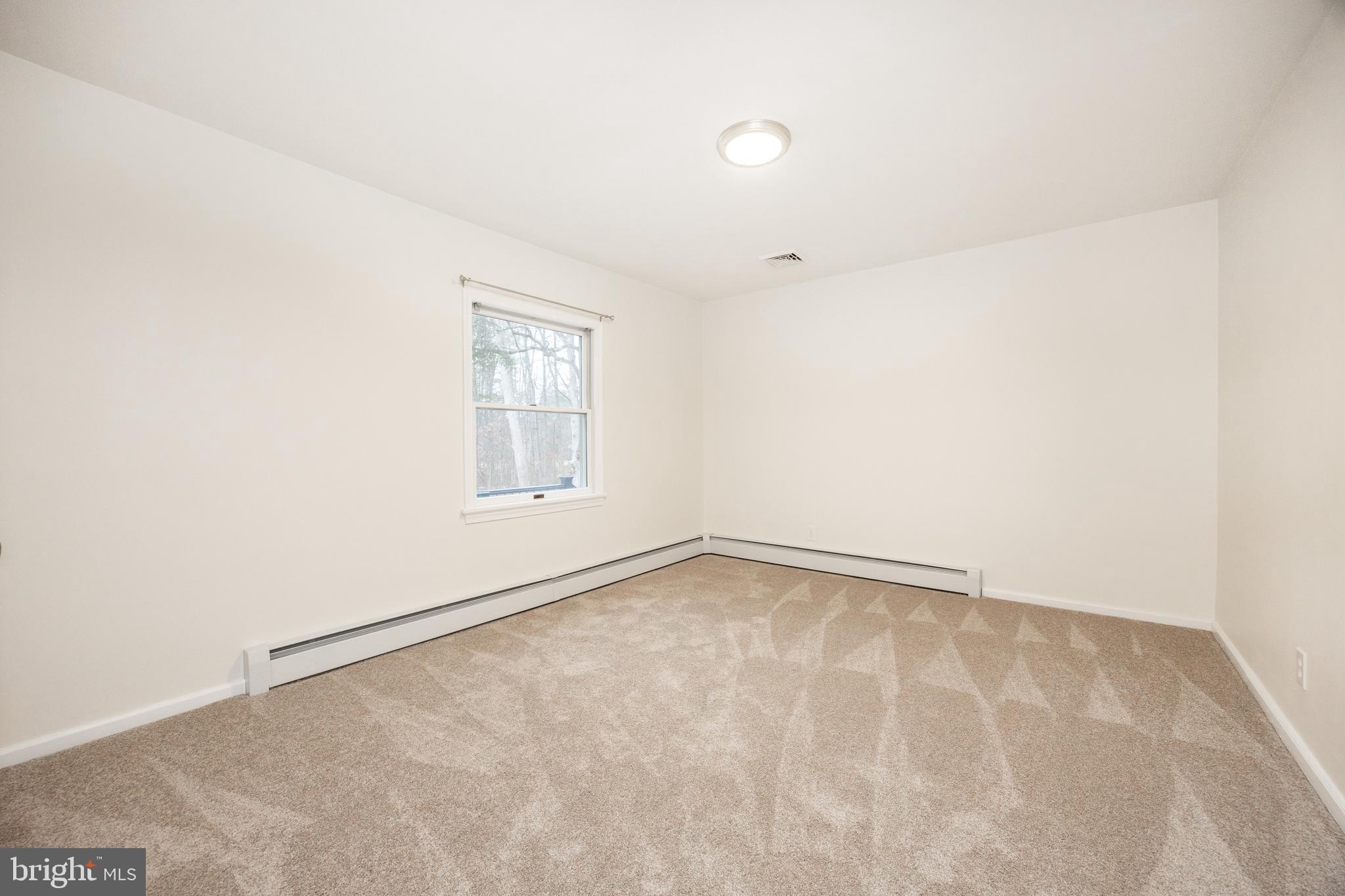 5816 Upper Ridge Road Pennsburg, PA 18073 - Photo 20 of 71 an empty room with a empty space and window