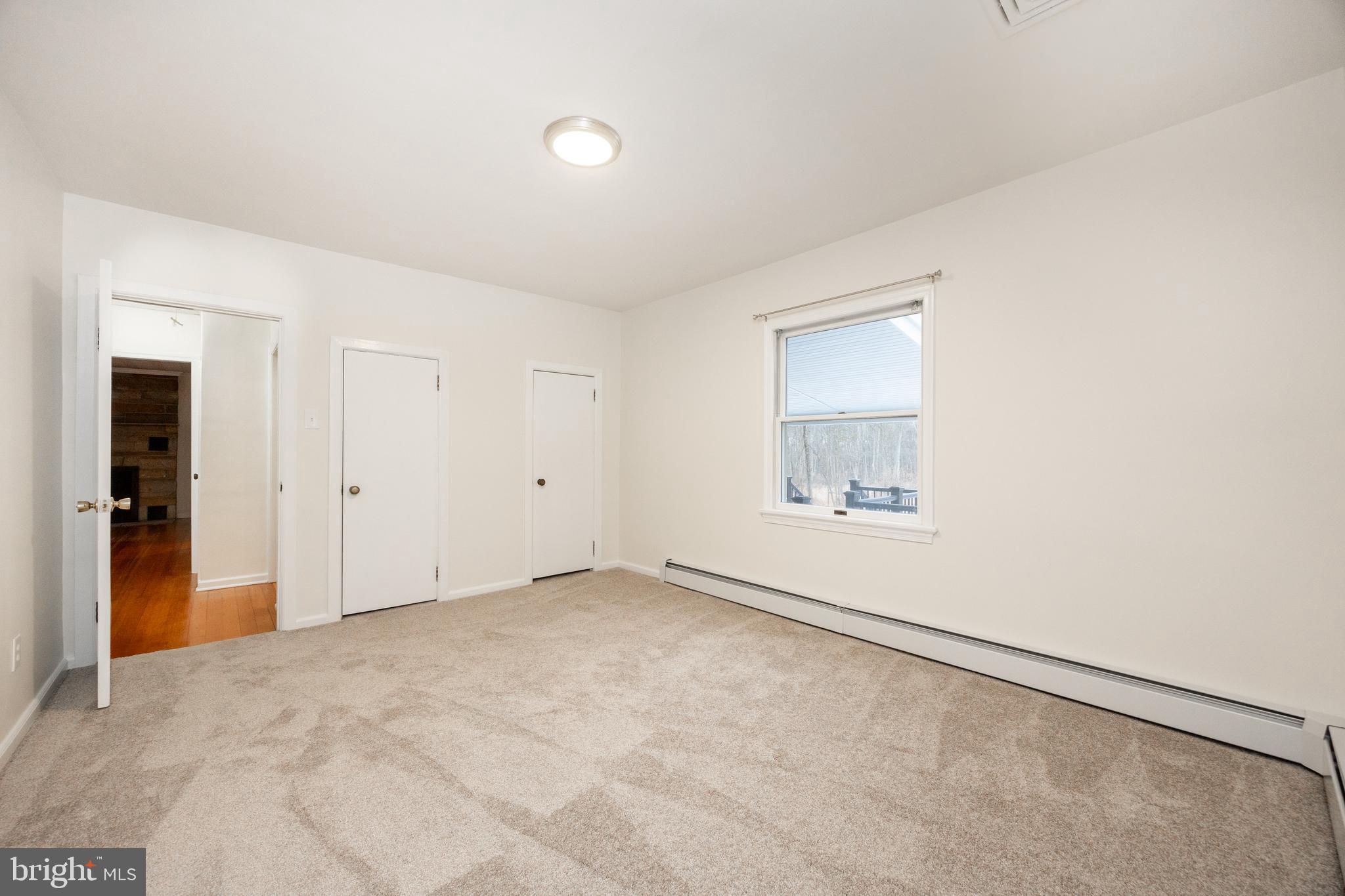 5816 Upper Ridge Road Pennsburg, PA 18073 - Photo 21 of 71 an empty room with windows and closet