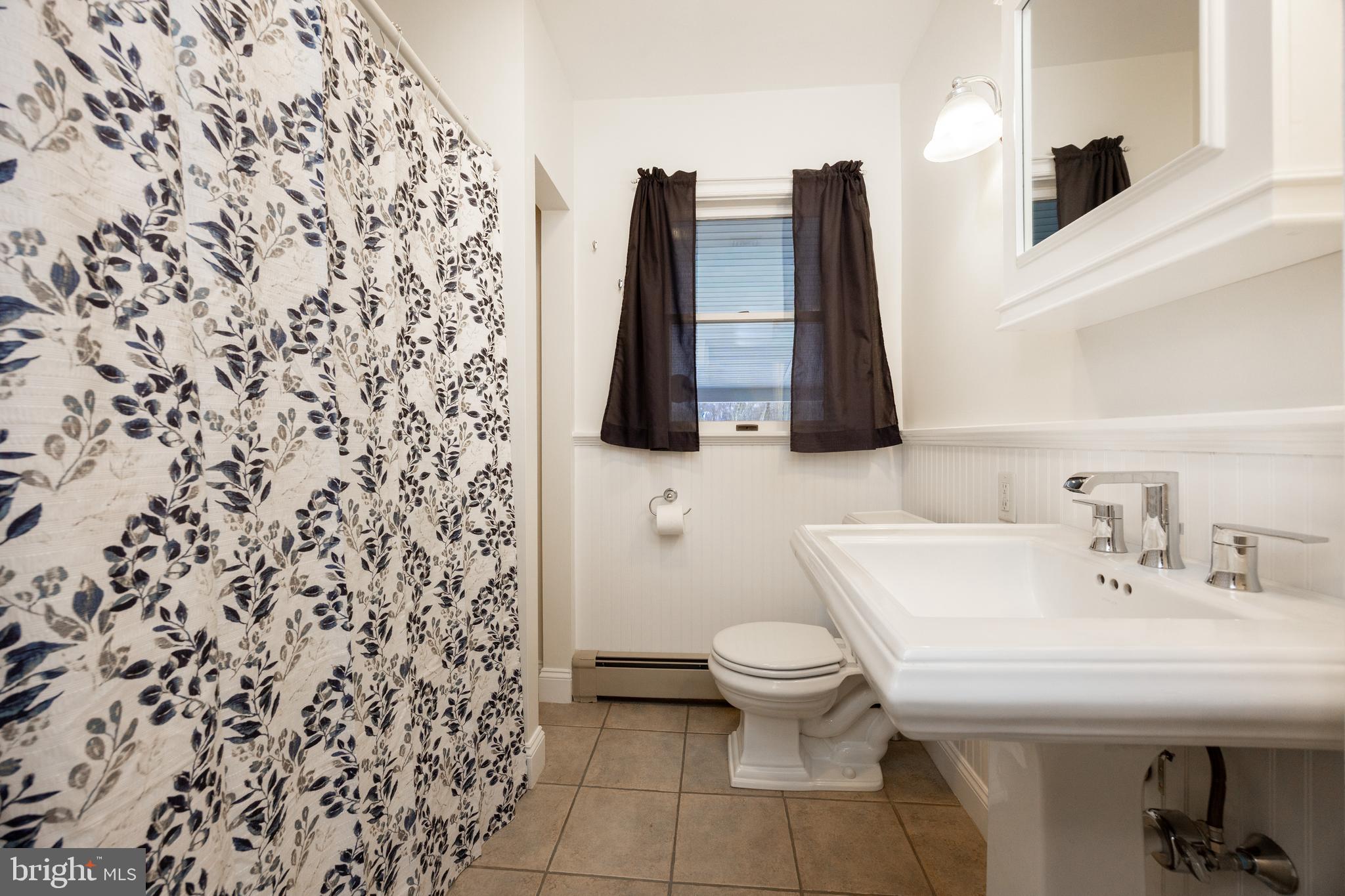 5816 Upper Ridge Road Pennsburg, PA 18073 - Photo 22 of 71 a bathroom with a sink and a toilet