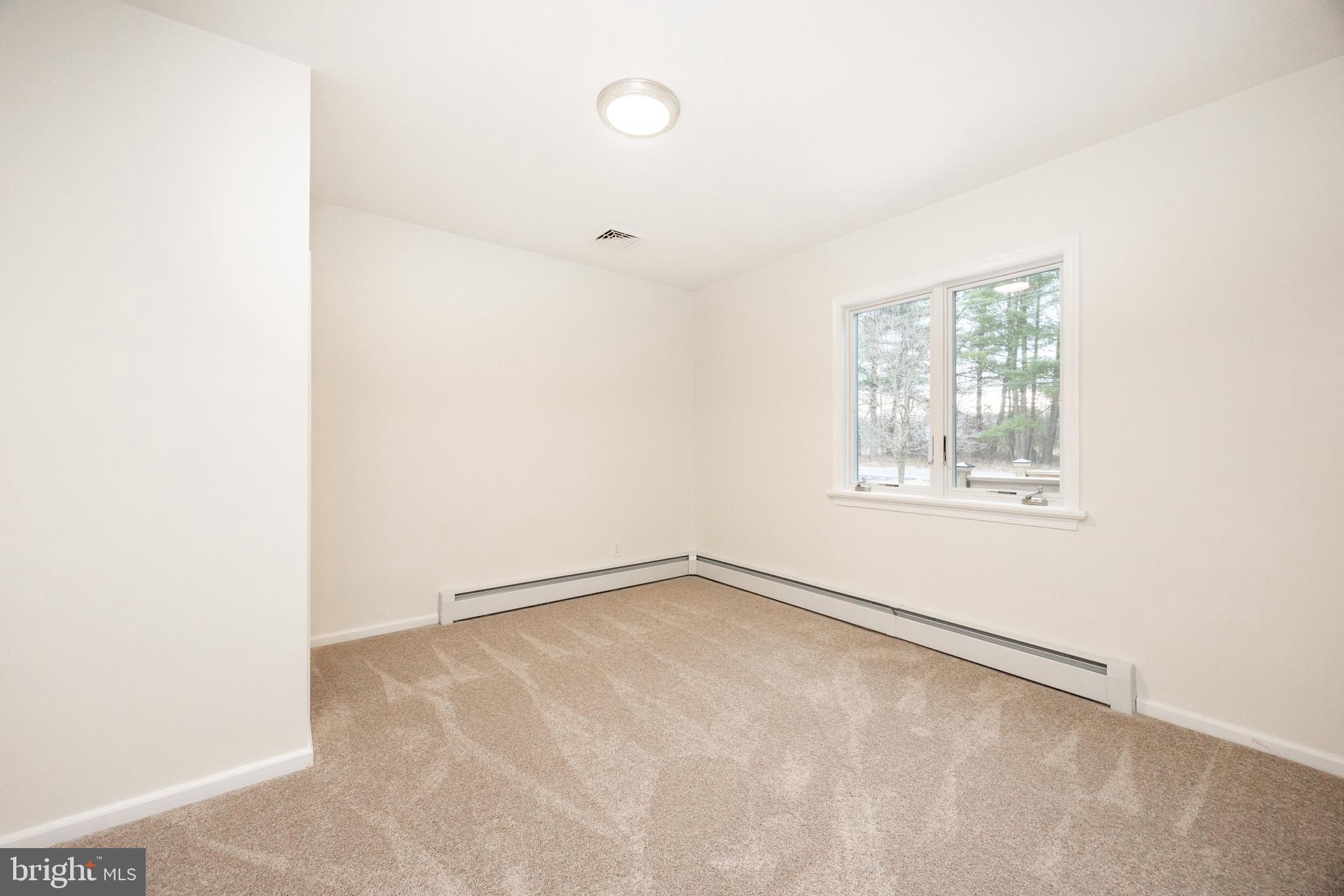 5816 Upper Ridge Road Pennsburg, PA 18073 - Photo 23 of 71 an empty room with windows