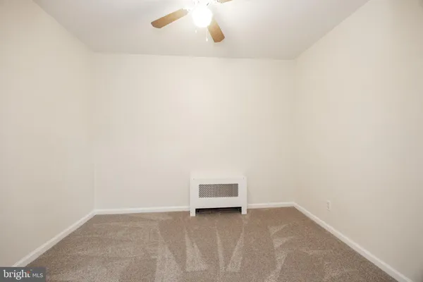 a view of a room with an empty space