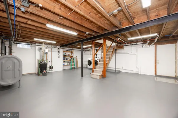 a view of backyard with deck and seating space