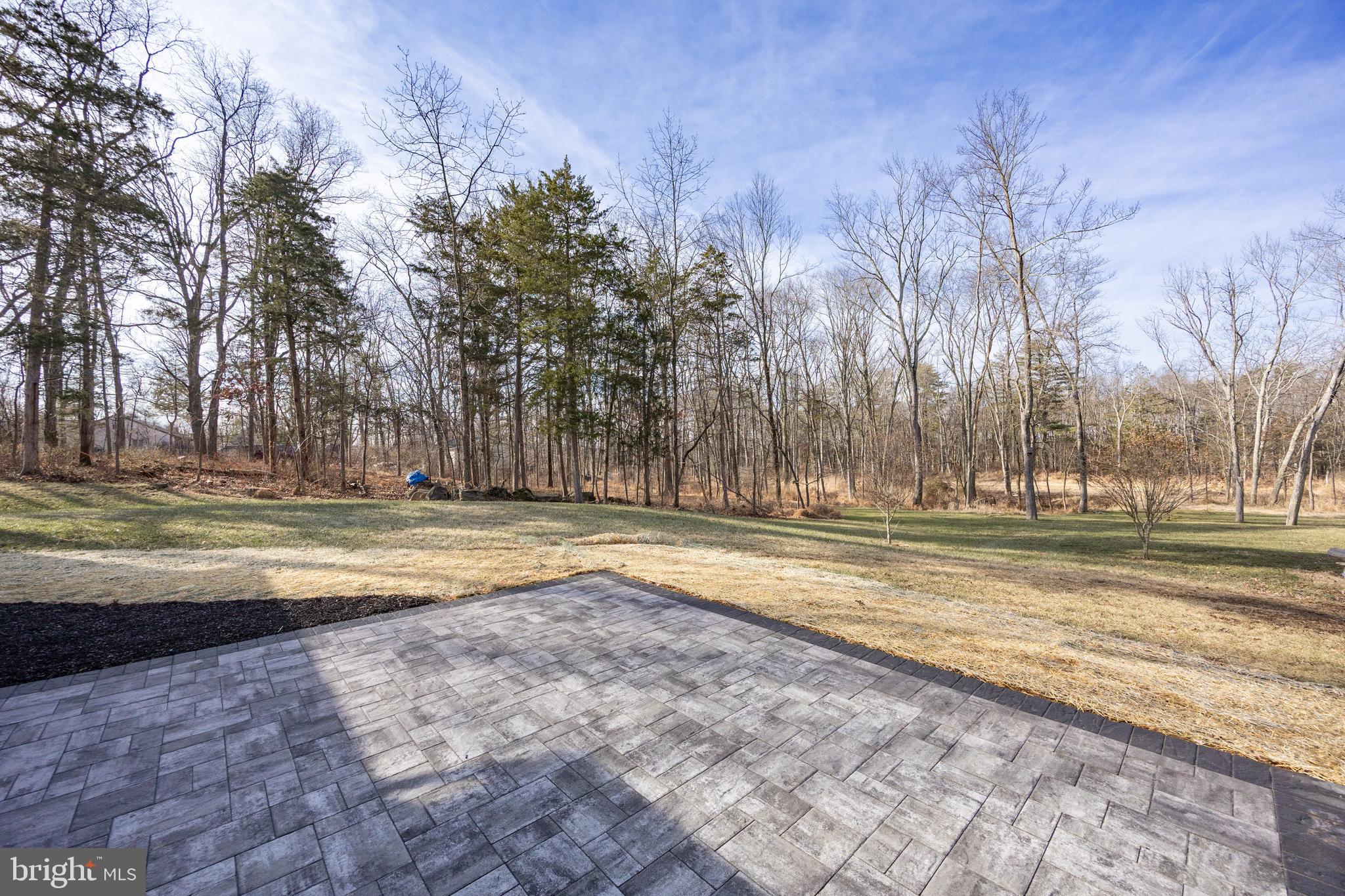 5816 Upper Ridge Road Pennsburg, PA 18073 - Photo 36 of 71 a view of the house with yard and trees in the background