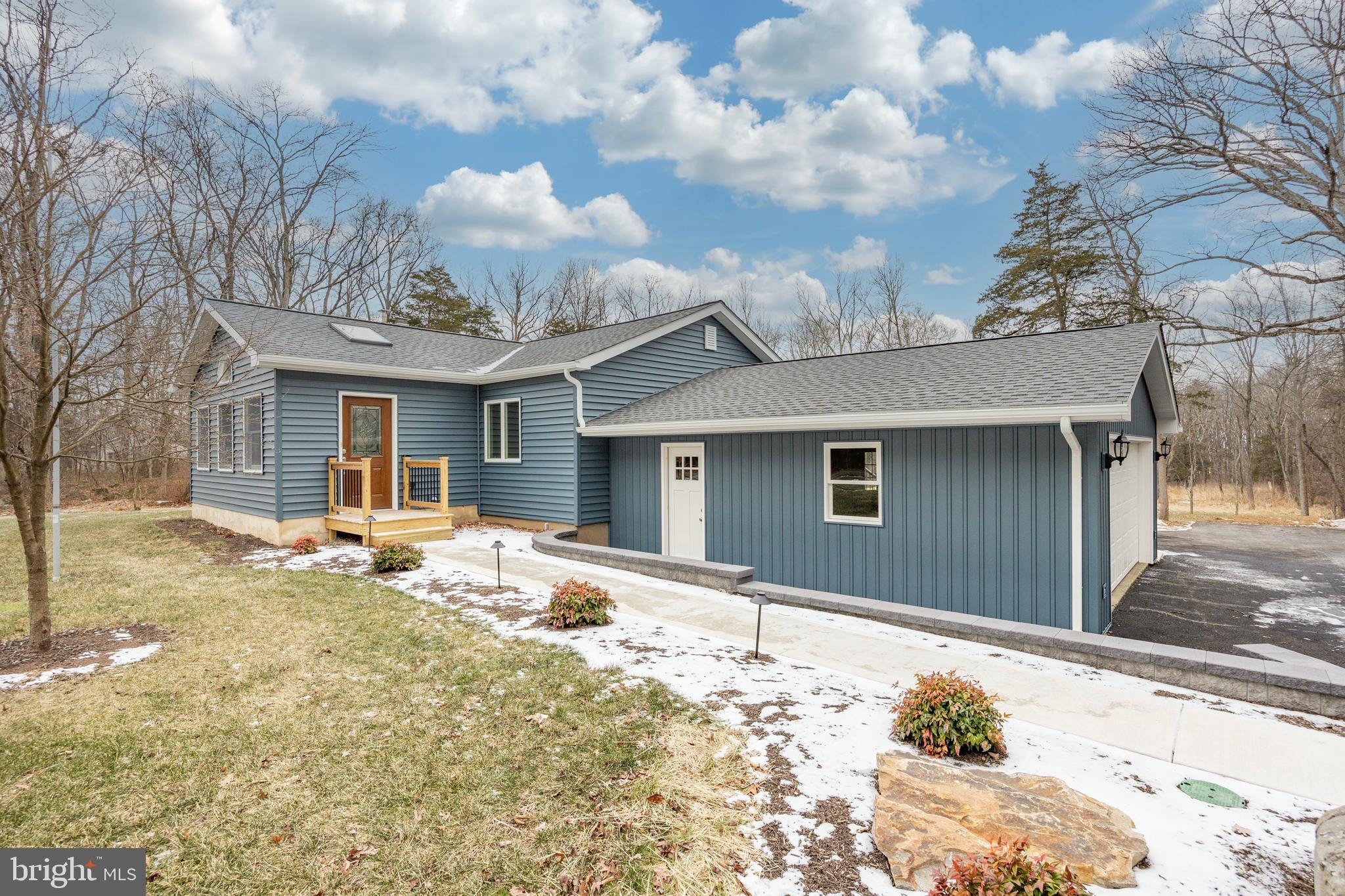 5816 Upper Ridge Road Pennsburg, PA 18073 - Photo 41 of 71 a front view of a house with a yard and garage