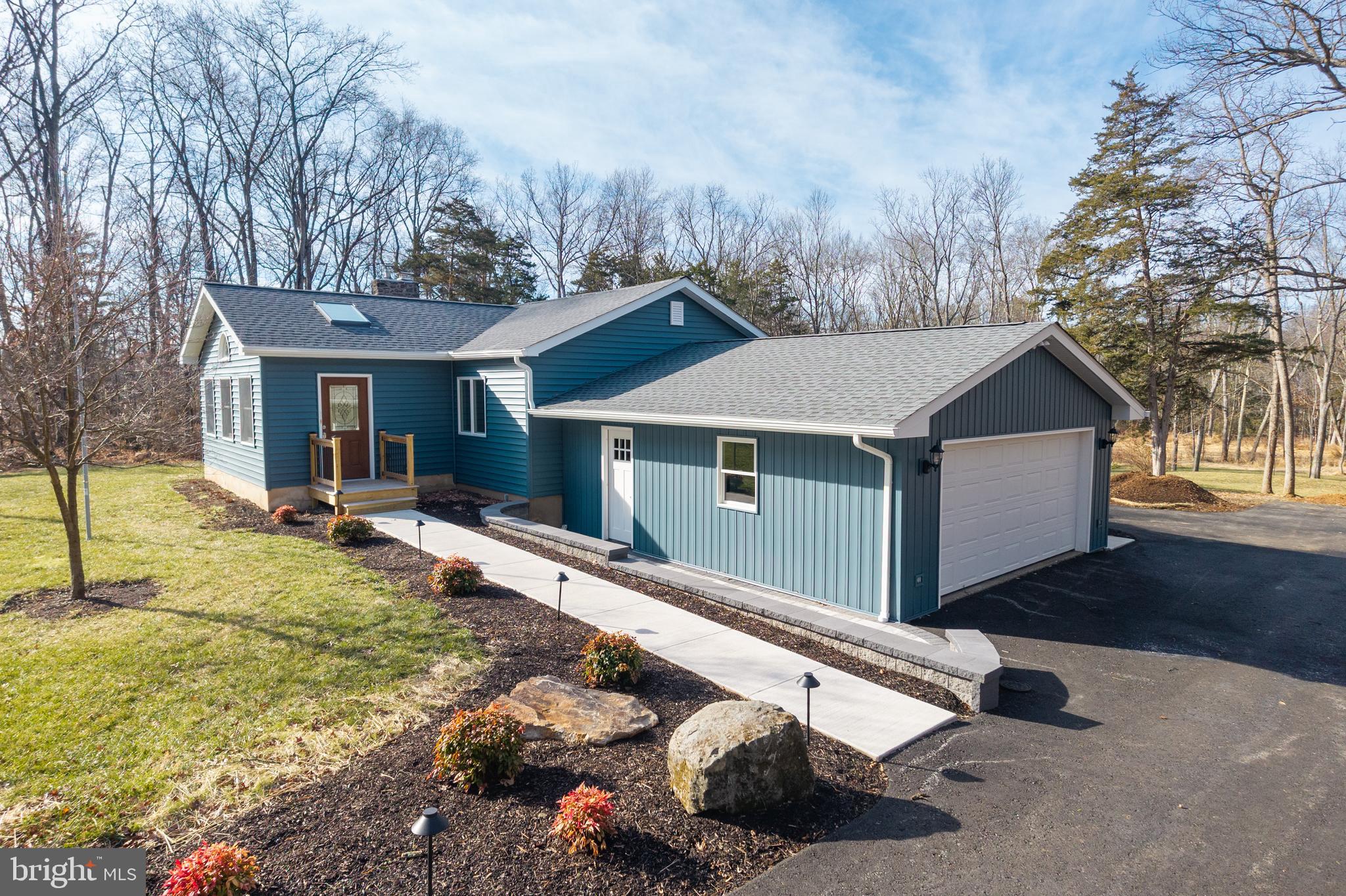5816 Upper Ridge Road Pennsburg, PA 18073 - Photo 44 of 71 a front view of house with yard and trees in the background