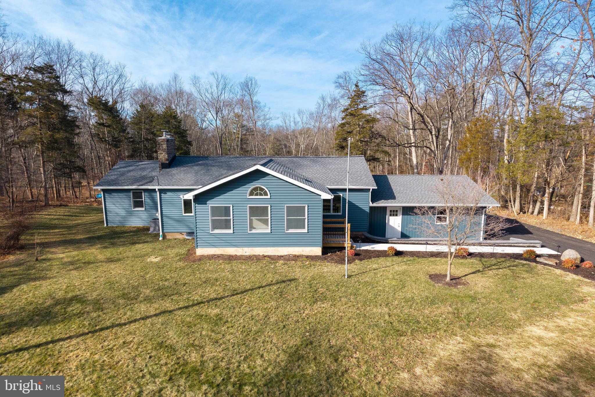 5816 Upper Ridge Road Pennsburg, PA 18073 - Photo 45 of 71 a view of a house with a big yard and large tree
