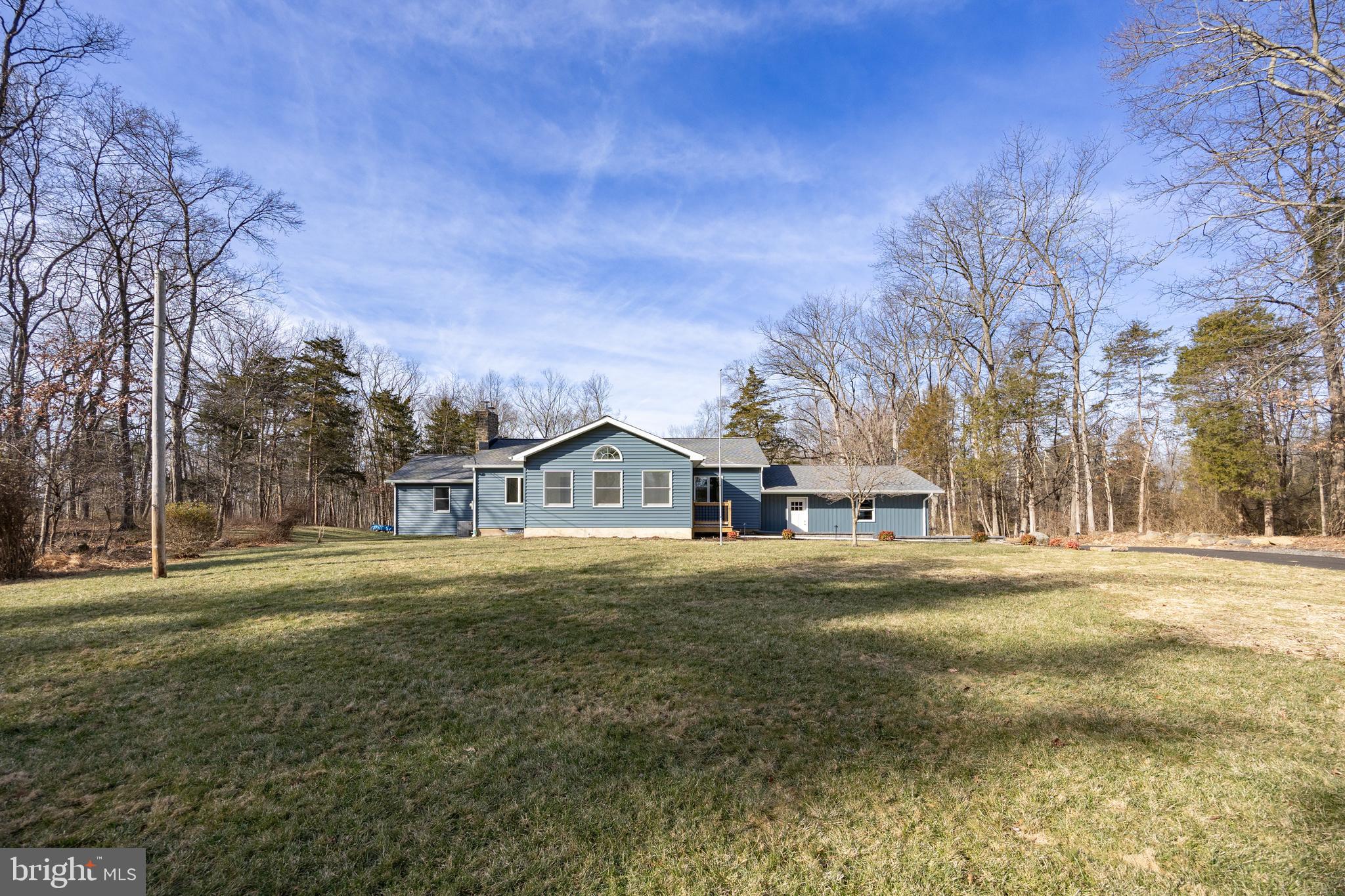 5816 Upper Ridge Road Pennsburg, PA 18073 - Photo 62 of 71 a front view of a house with a yard and garage