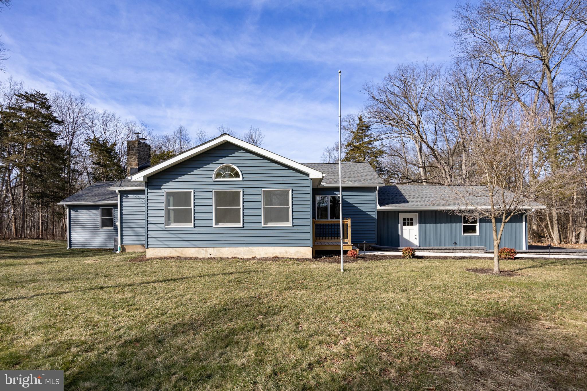 5816 Upper Ridge Road Pennsburg, PA 18073 - Photo 64 of 71 a front view of house with yard and trees in the background