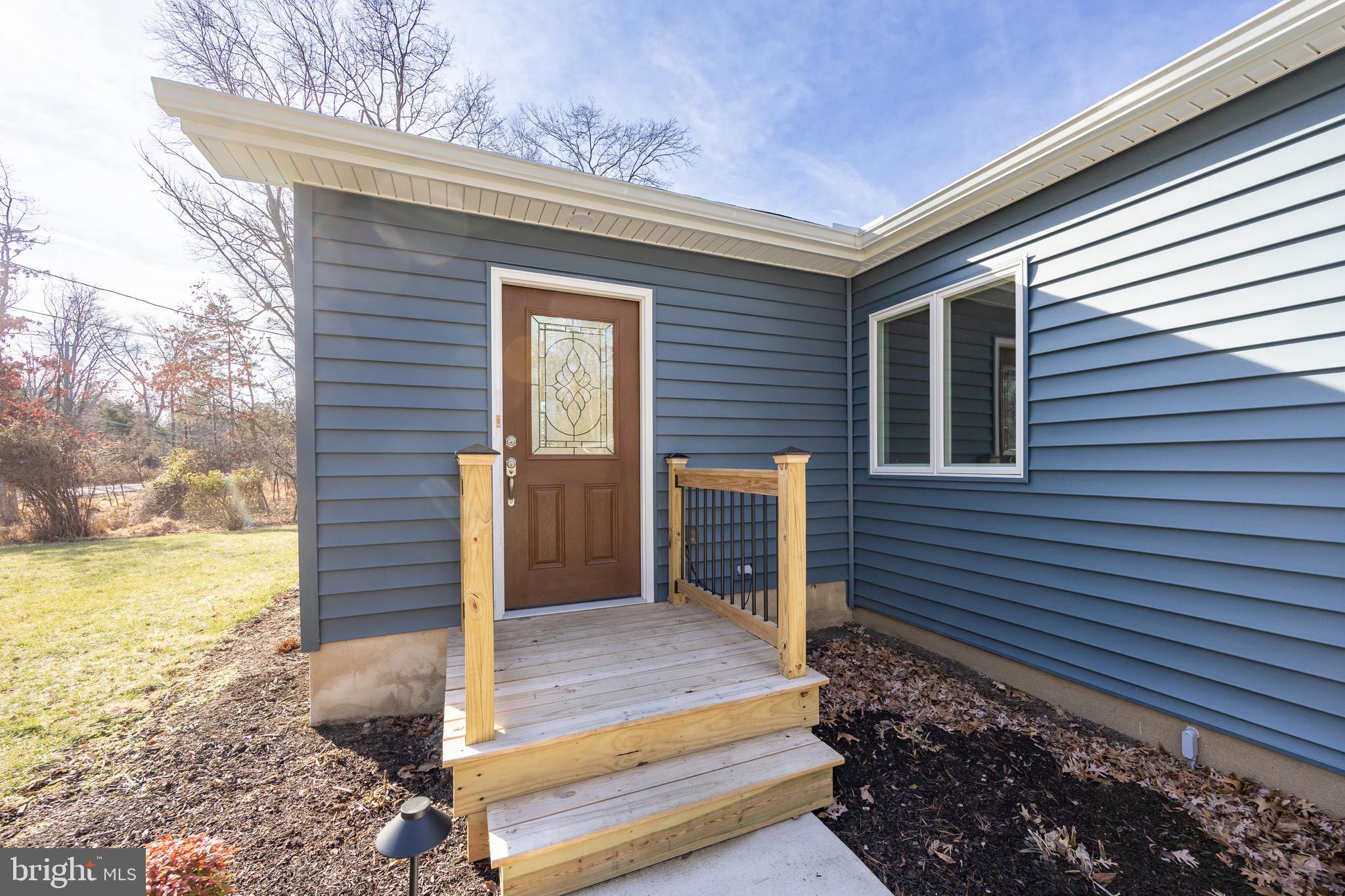5816 Upper Ridge Road Pennsburg, PA 18073 - Photo 65 of 71 a brick house with a large window and yard