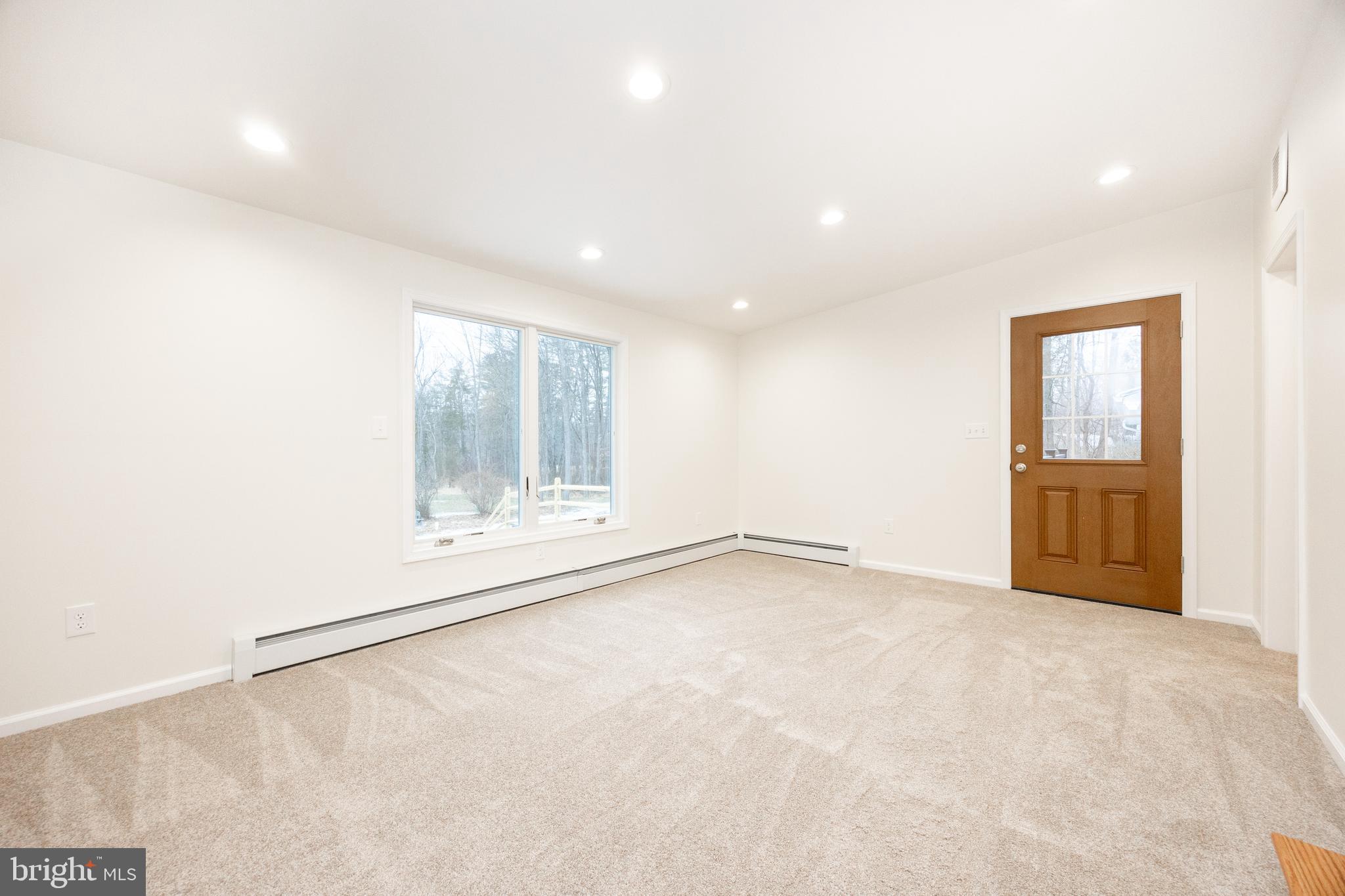 5816 Upper Ridge Road Pennsburg, PA 18073 - Photo 7 of 71 an empty room with a empty space and windows