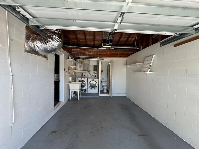 a view of backyard with wooden fence