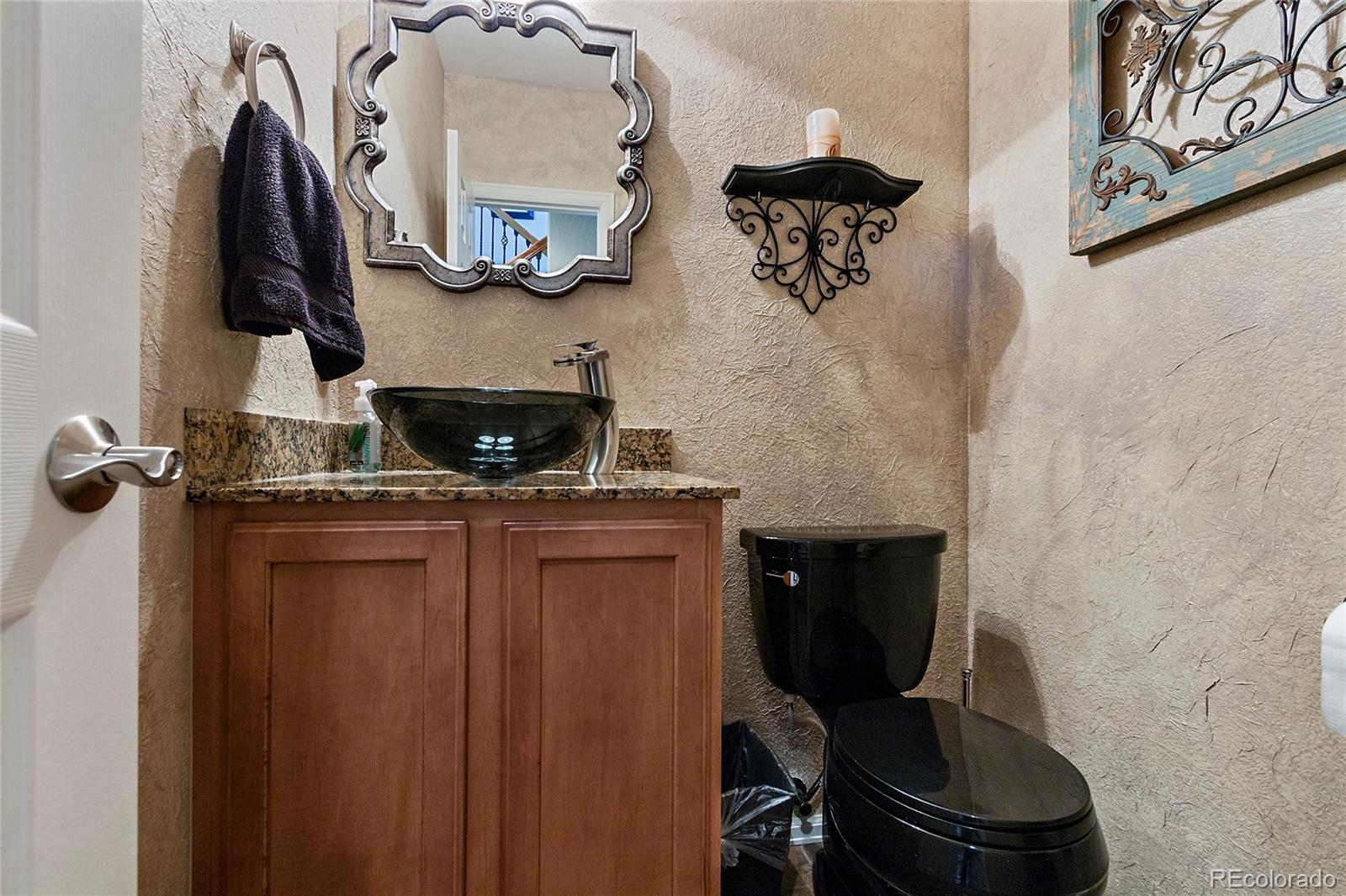 8151 Raspberry Drive Frederick, CO 80504 - Photo 16 of 35 a bathroom with a toilet and a sink