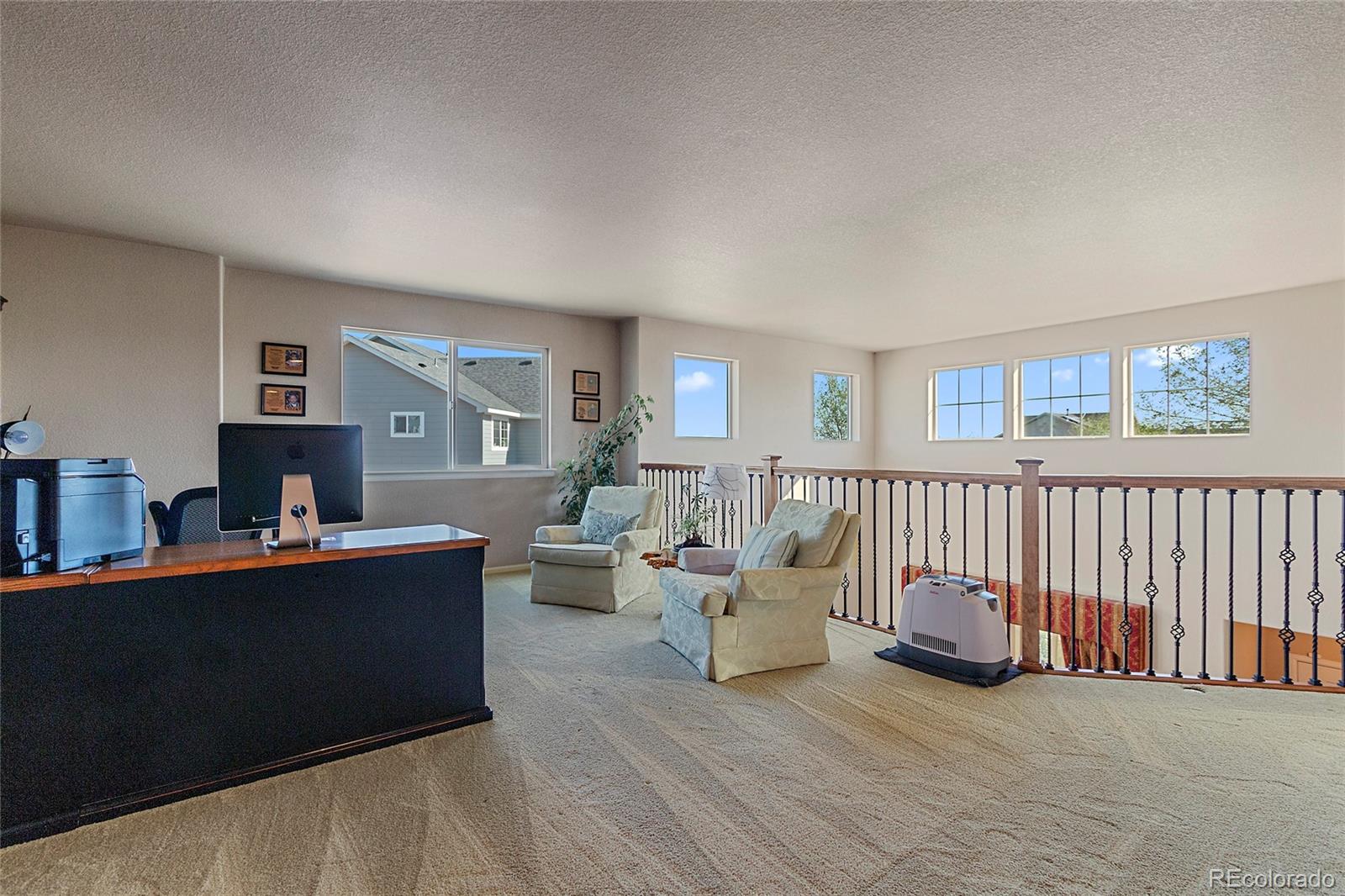 8151 Raspberry Drive Frederick, CO 80504 - Photo 17 of 35 a living room with furniture and a window