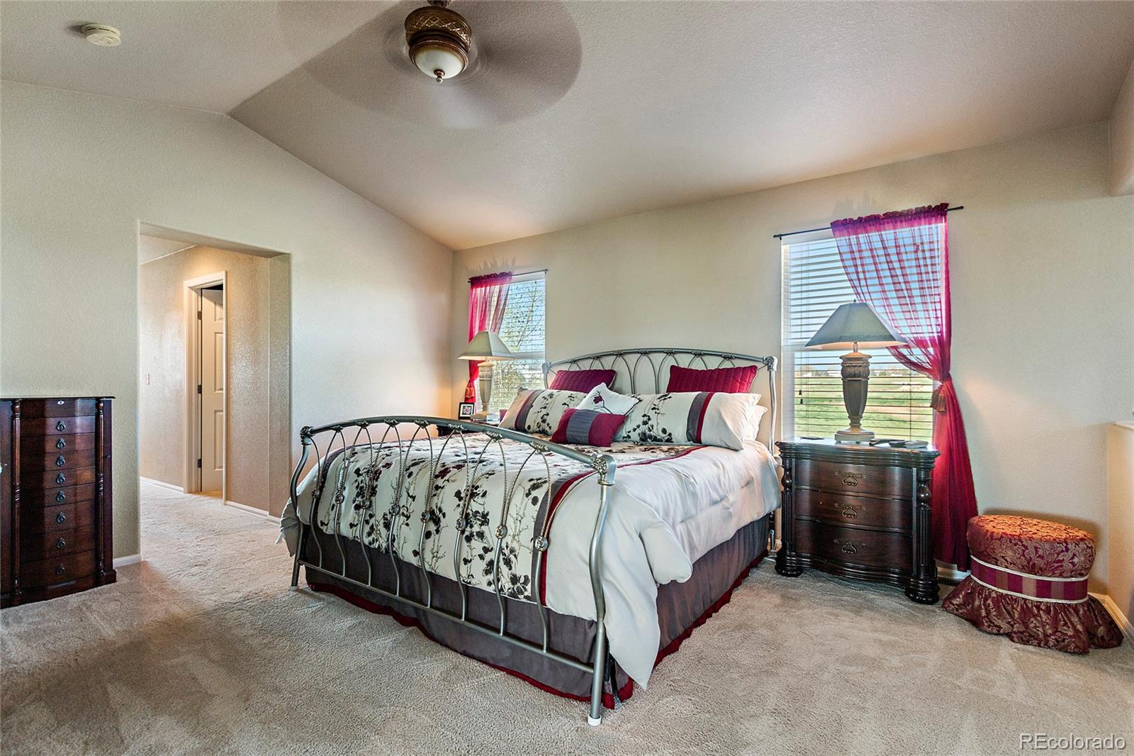 8151 Raspberry Drive Frederick, CO 80504 - Photo 19 of 35 a bedroom with a bed and a dresser
