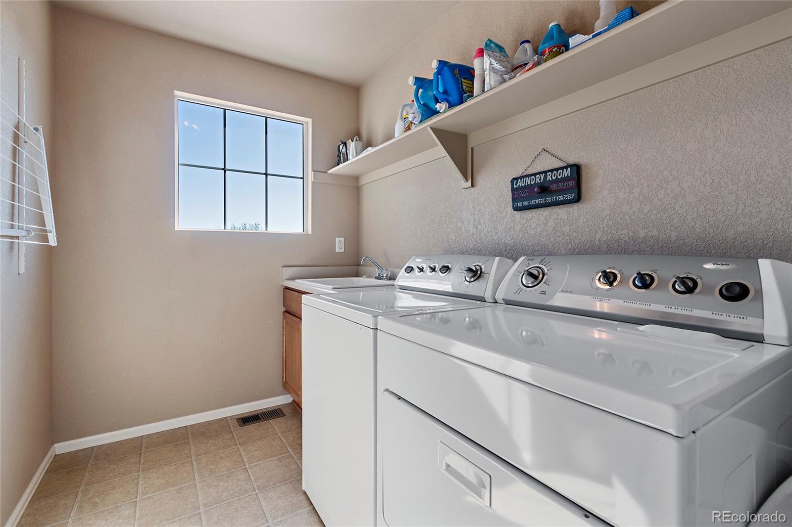 8151 Raspberry Drive Frederick, CO 80504 - Photo 28 of 35 a utility room with washer and dryer