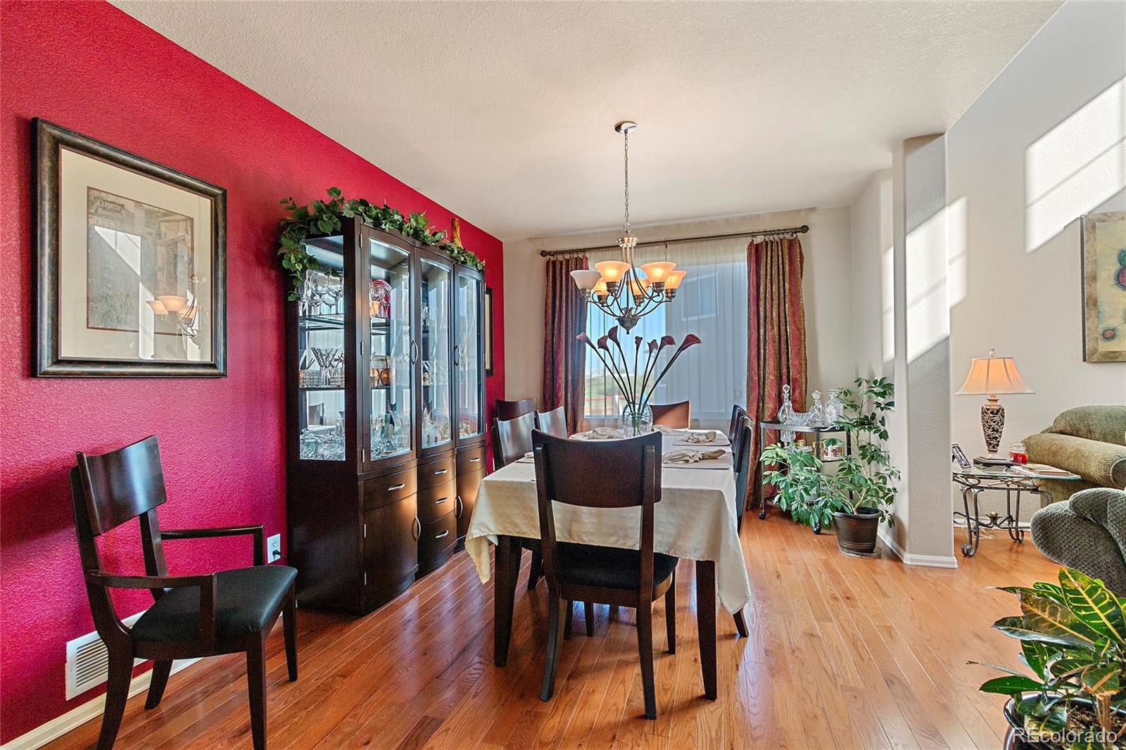 8151 Raspberry Drive Frederick, CO 80504 - Photo 5 of 35 a view of a dining room with furniture window and wooden floor