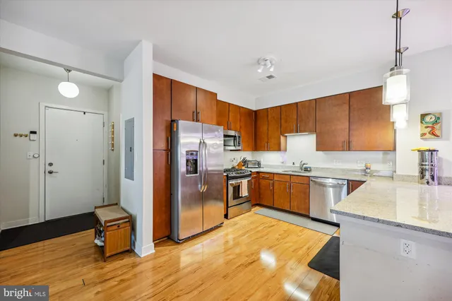 a view of a dining room with furniture and wooden floor