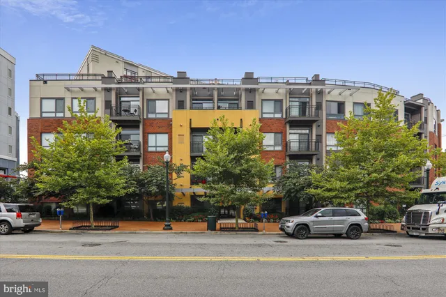 a view of a car parked in front of a building