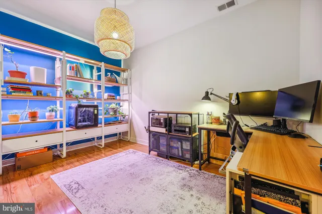 a living room with furniture and a mirror