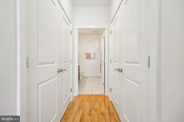 a bedroom with a bed and a book shelf