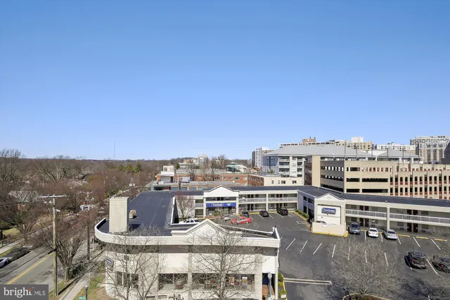 a view of a building with a backyard