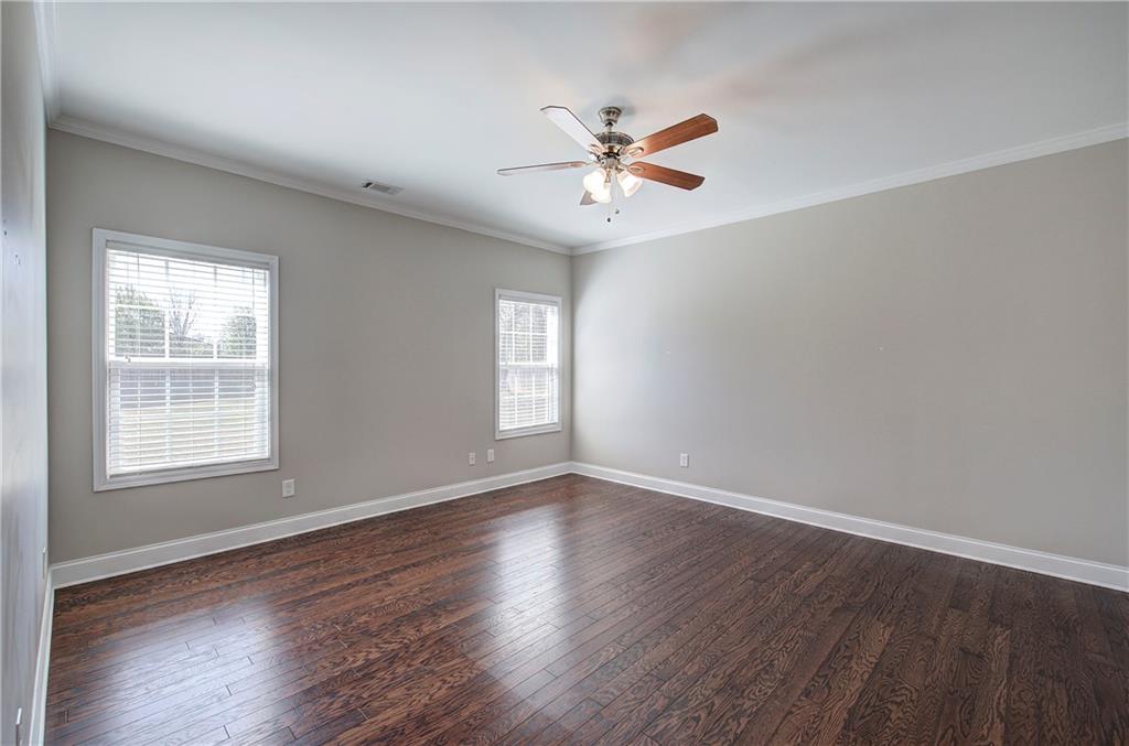 25 Winter Pointe Northwest Cartersville, GA 30121 - Photo 16 of 43 a view of an empty room with wooden floor and a window