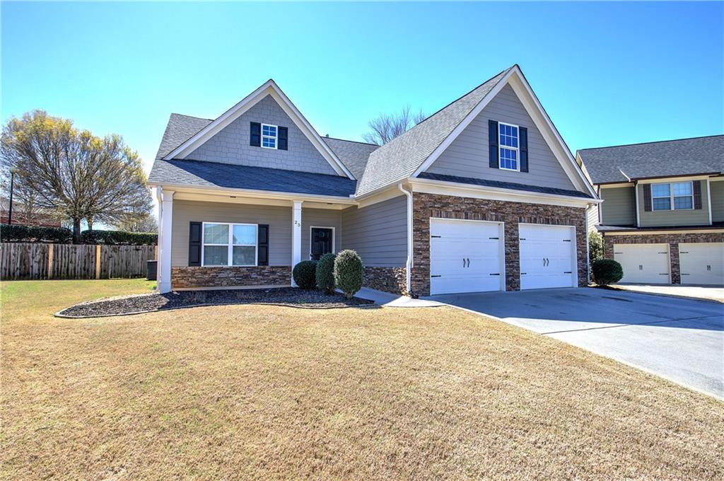 25 Winter Pointe Northwest Cartersville, GA 30121 - Photo 2 of 43 a front view of a house with a yard and garage