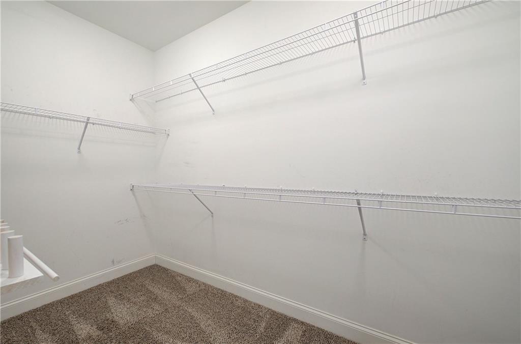 25 Winter Pointe Northwest Cartersville, GA 30121 - Photo 22 of 43 a view of a room with racks on the wall