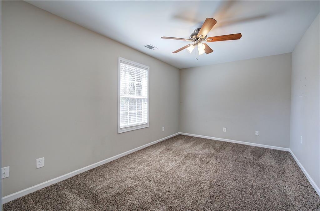 25 Winter Pointe Northwest Cartersville, GA 30121 - Photo 27 of 43 an empty room with windows and fan