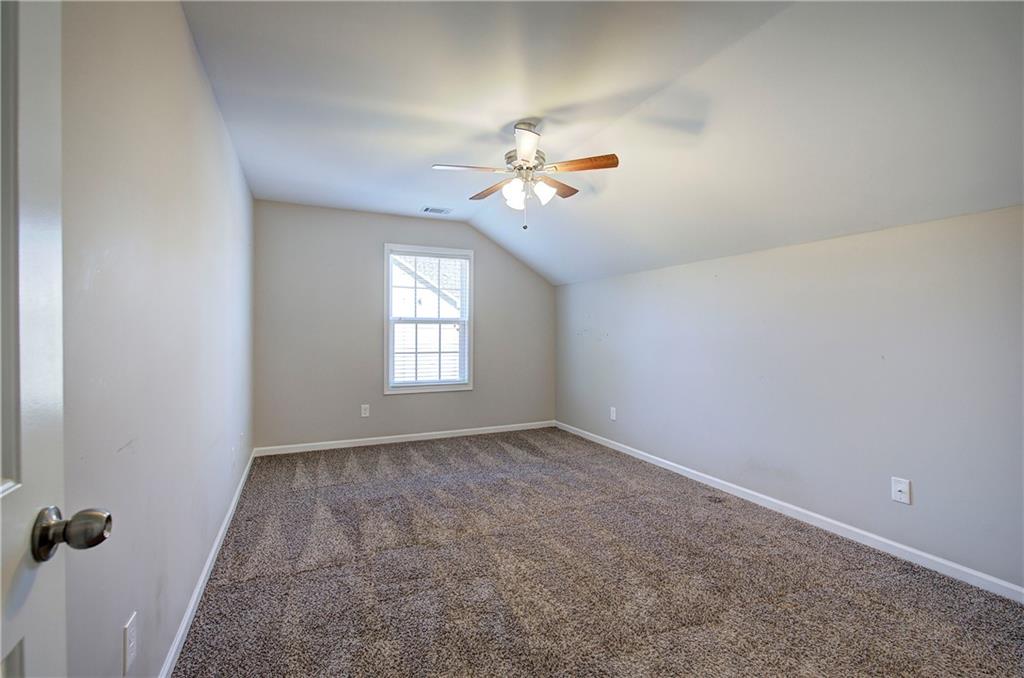 25 Winter Pointe Northwest Cartersville, GA 30121 - Photo 29 of 43 a view of a room with a ceiling fan and a window