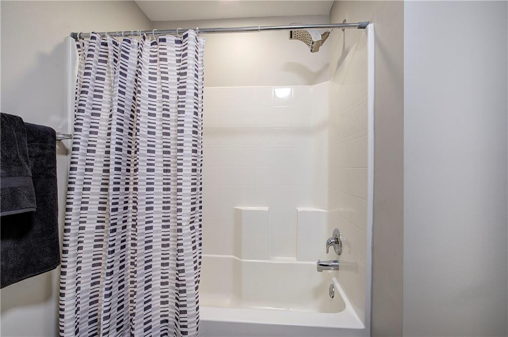 25 Winter Pointe Northwest Cartersville, GA 30121 - Photo 33 of 43 a bathroom with a shower curtain and a sink