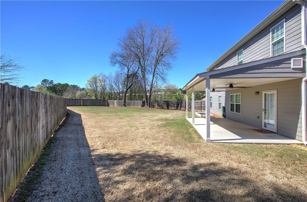 25 Winter Pointe Northwest Cartersville, GA 30121 - Photo 36 of 43 a view of a house with backyard and trees