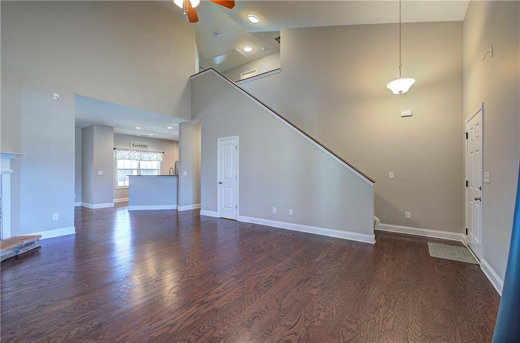 25 Winter Pointe Northwest Cartersville, GA 30121 - Photo 4 of 43 a view of an empty room with wooden floor and windows