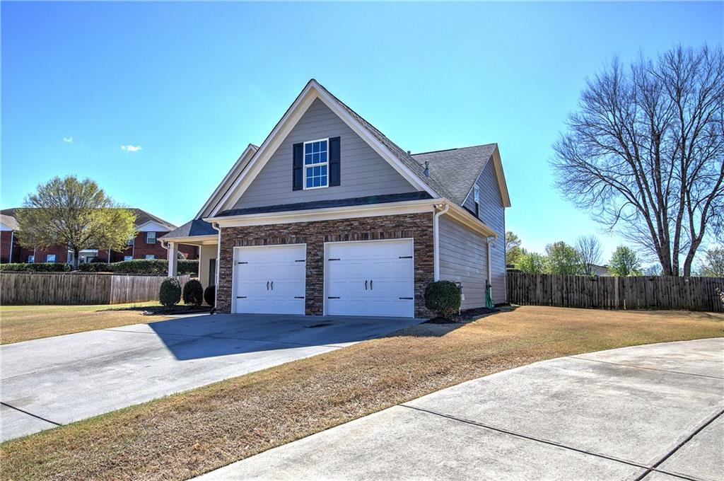 25 Winter Pointe Northwest Cartersville, GA 30121 - Photo 42 of 43 a front view of a house with a yard and garage