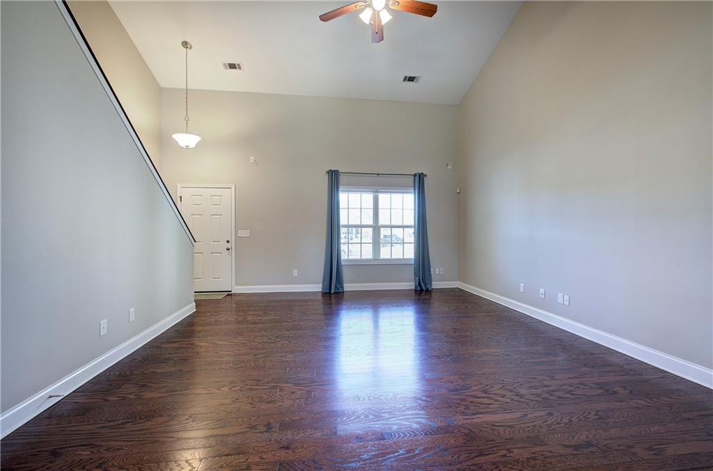 25 Winter Pointe Northwest Cartersville, GA 30121 - Photo 8 of 43 wooden floor in an empty room with a window