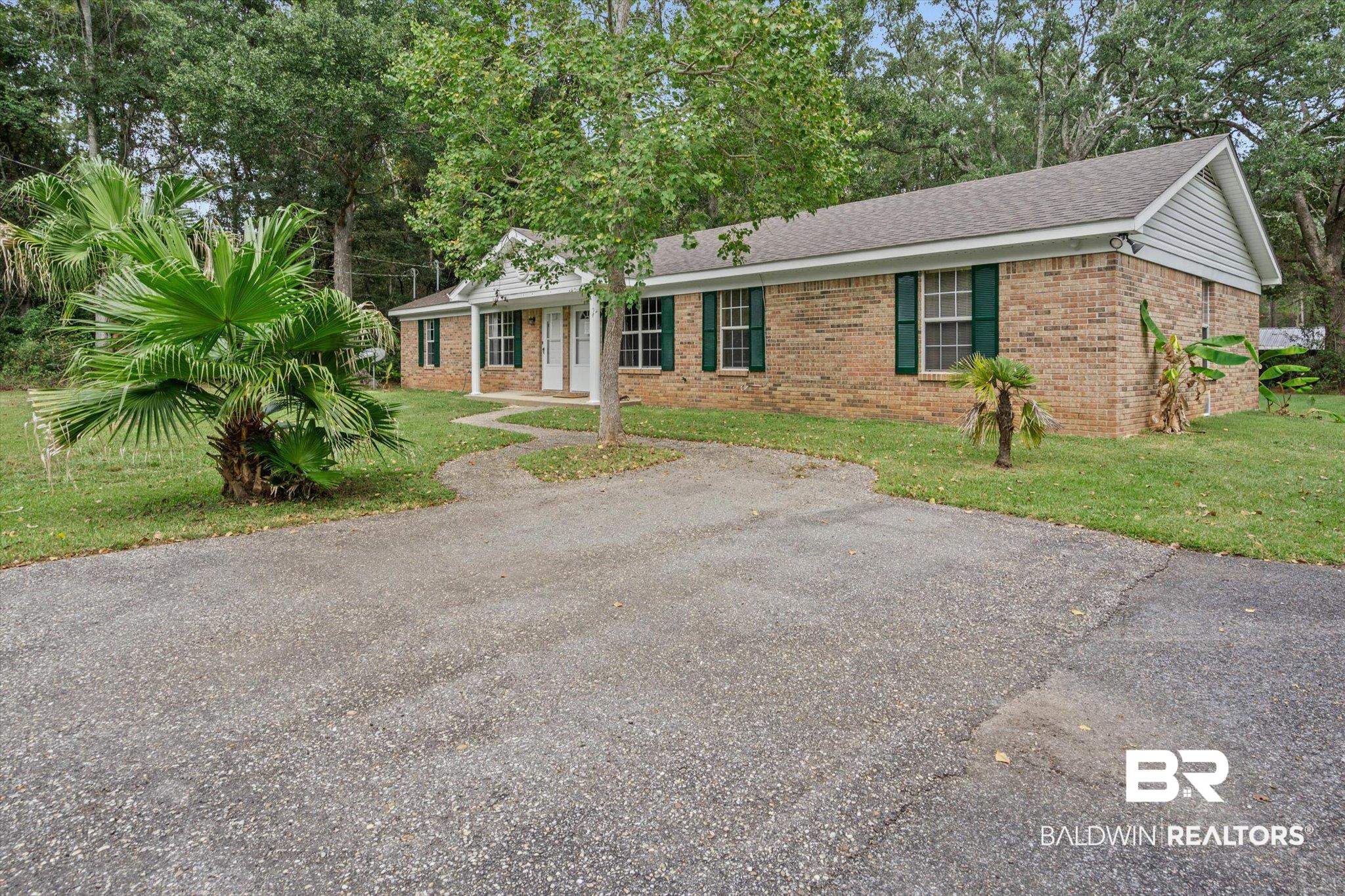 14165 River Oaks Road, Unit A & B Coden, AL 36523 - Photo 32 of 35 Single story home featuring a front yard, brick siding, roof with shingles, and asphalt driveway