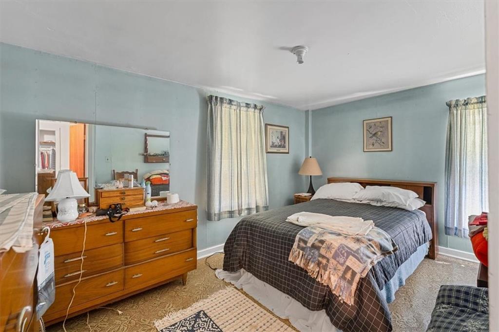 1182 Airport Road Aliquippa, PA 15001 - Photo 19 of 25 a bedroom with a bed and window