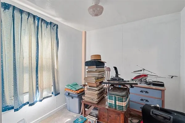 a bed room with a bed and a television