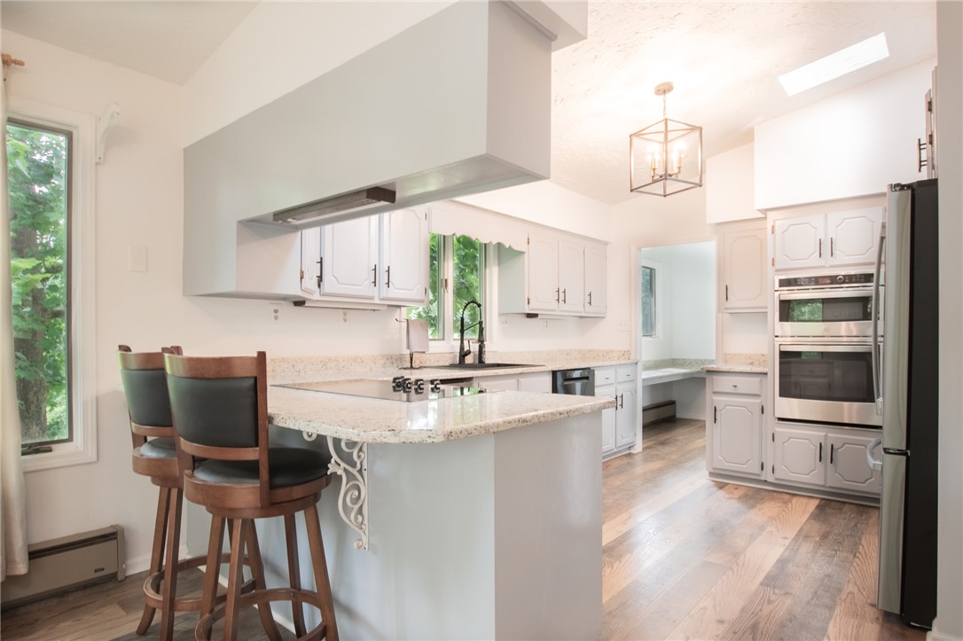 200 Chenault Road Townville, SC 29689 - Photo 12 of 47 Culinary adventures await in this naturally illuminated kitchen with granite counters and built-in appliances.
