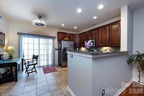 a open kitchen with dining table and chairs