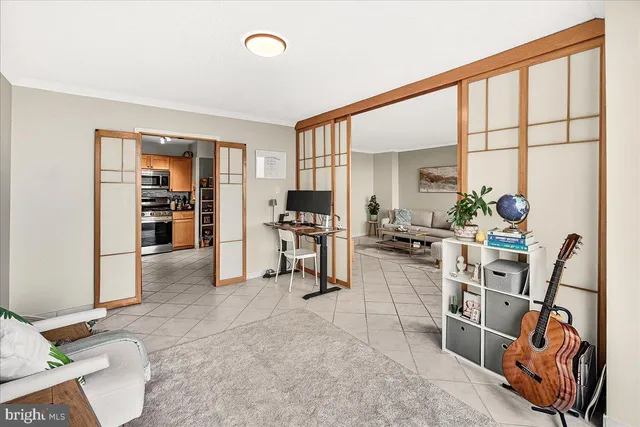 a room with lots of wooden furniture and windows