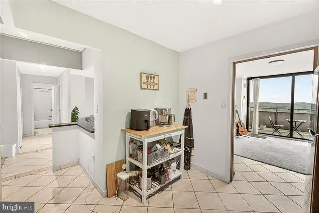 a view of a livingroom with furniture and a flat screen tv