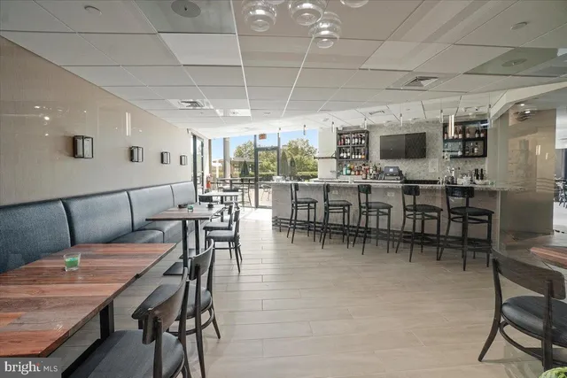 a view of a dining room with furniture window and outdoor view