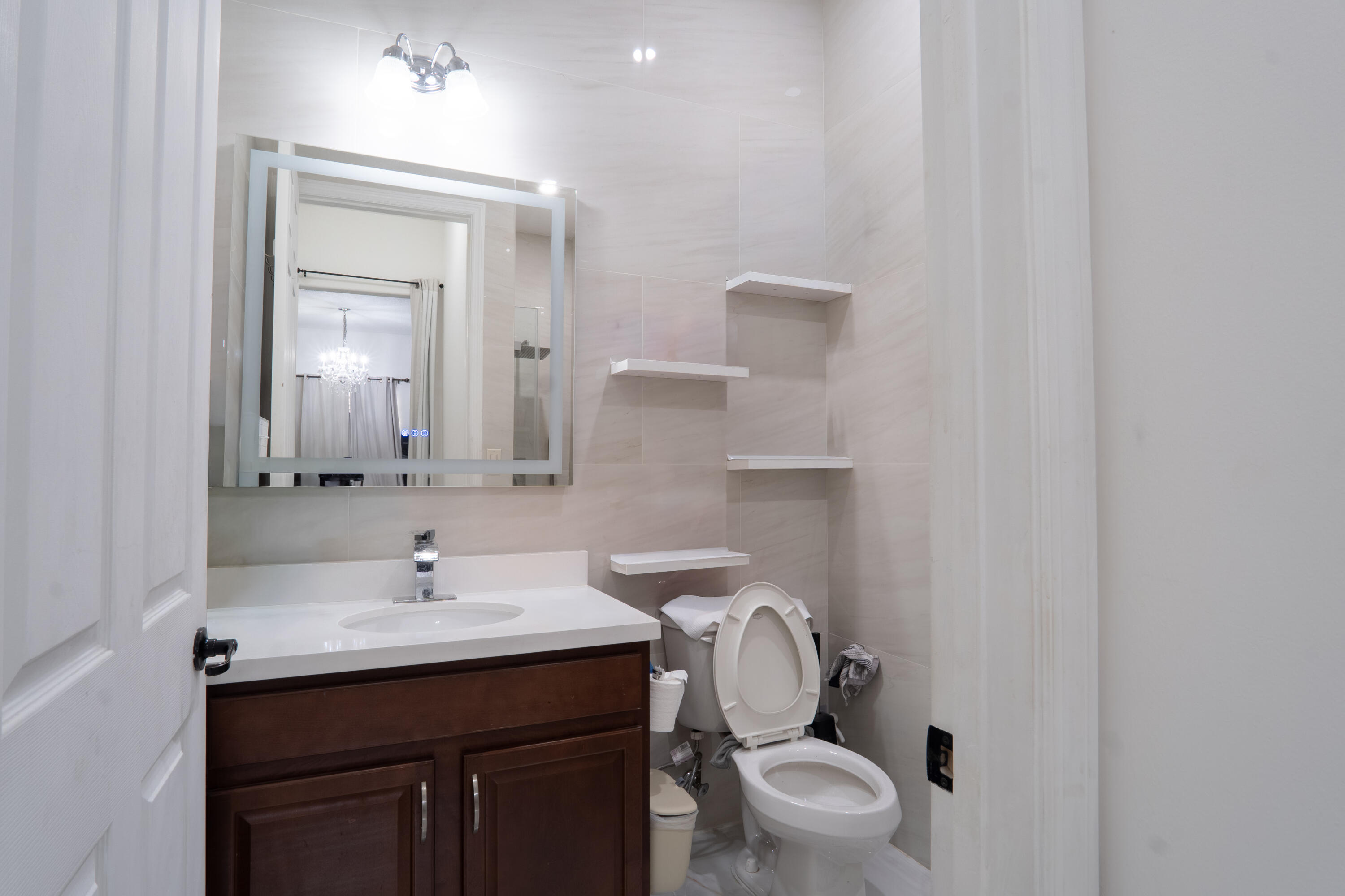 3573 Southwest 92nd Avenue Miramar, FL 33025 - Photo 15 of 24 a bathroom with a sink a toilet and mirror