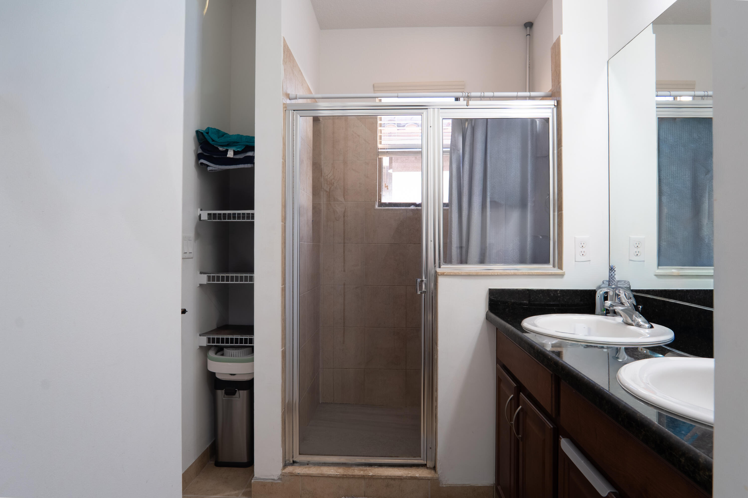 3573 Southwest 92nd Avenue Miramar, FL 33025 - Photo 19 of 24 a bathroom with a double vanity sink and mirror