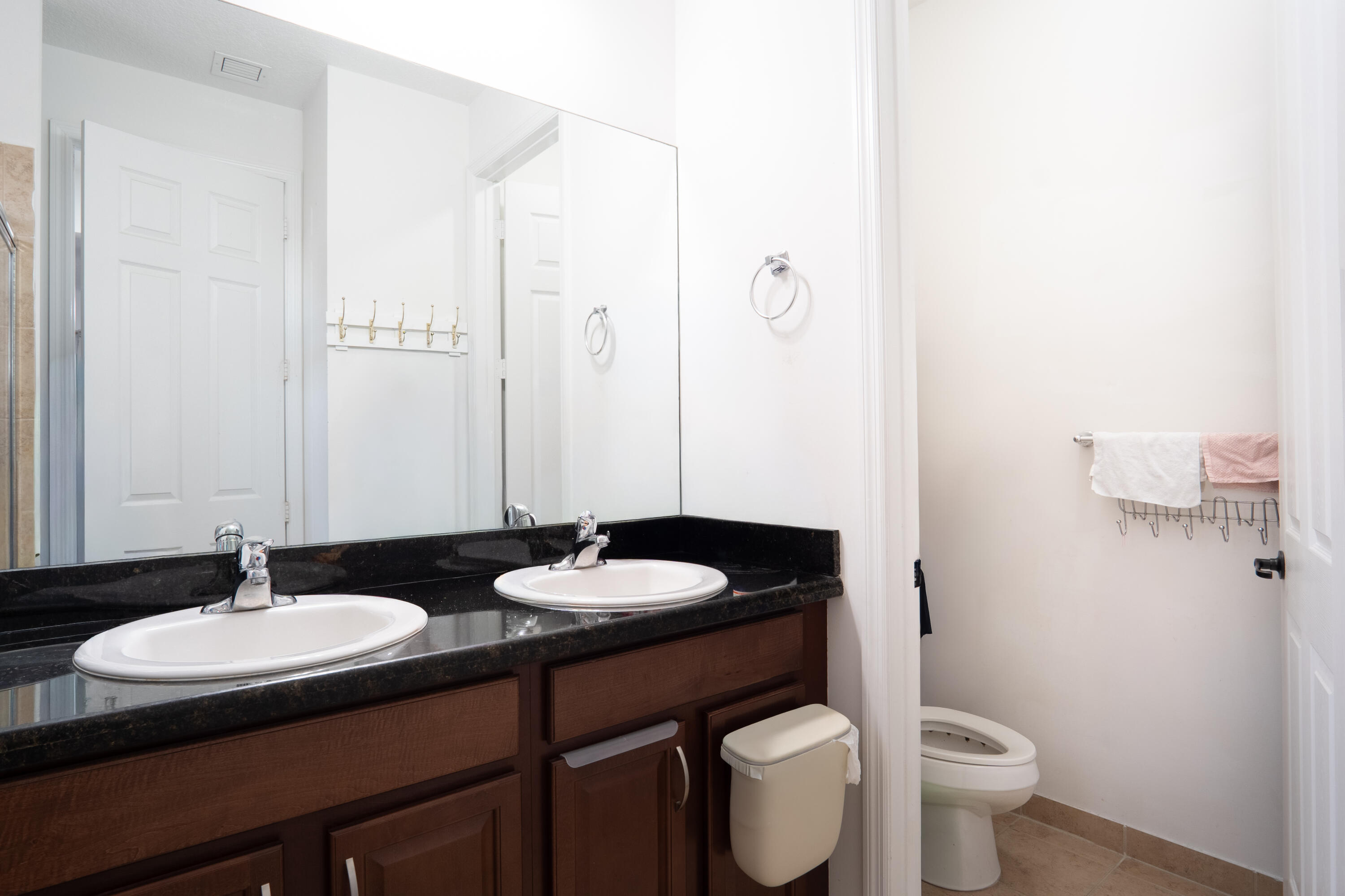 3573 Southwest 92nd Avenue Miramar, FL 33025 - Photo 20 of 24 a bathroom with a granite countertop sink and a mirror