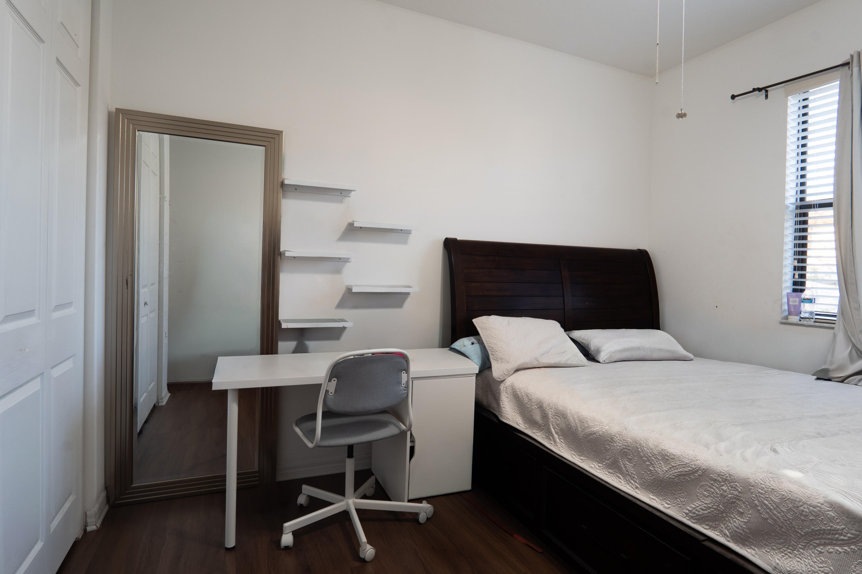 3573 Southwest 92nd Avenue Miramar, FL 33025 - Photo 21 of 24 a bedroom with a bed a desk and chair